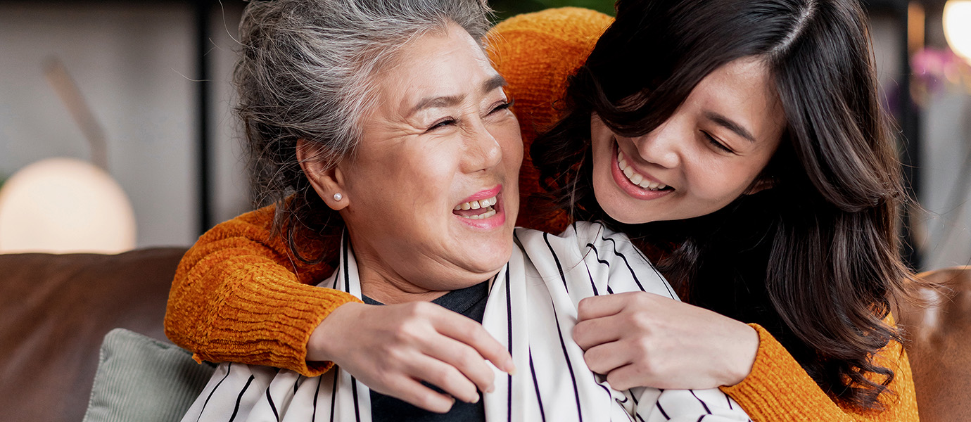 Child hugging their grandmother