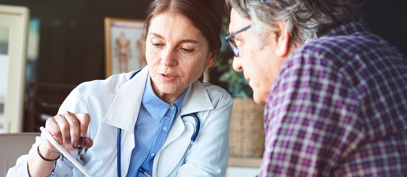 Doctor going over notes with patient