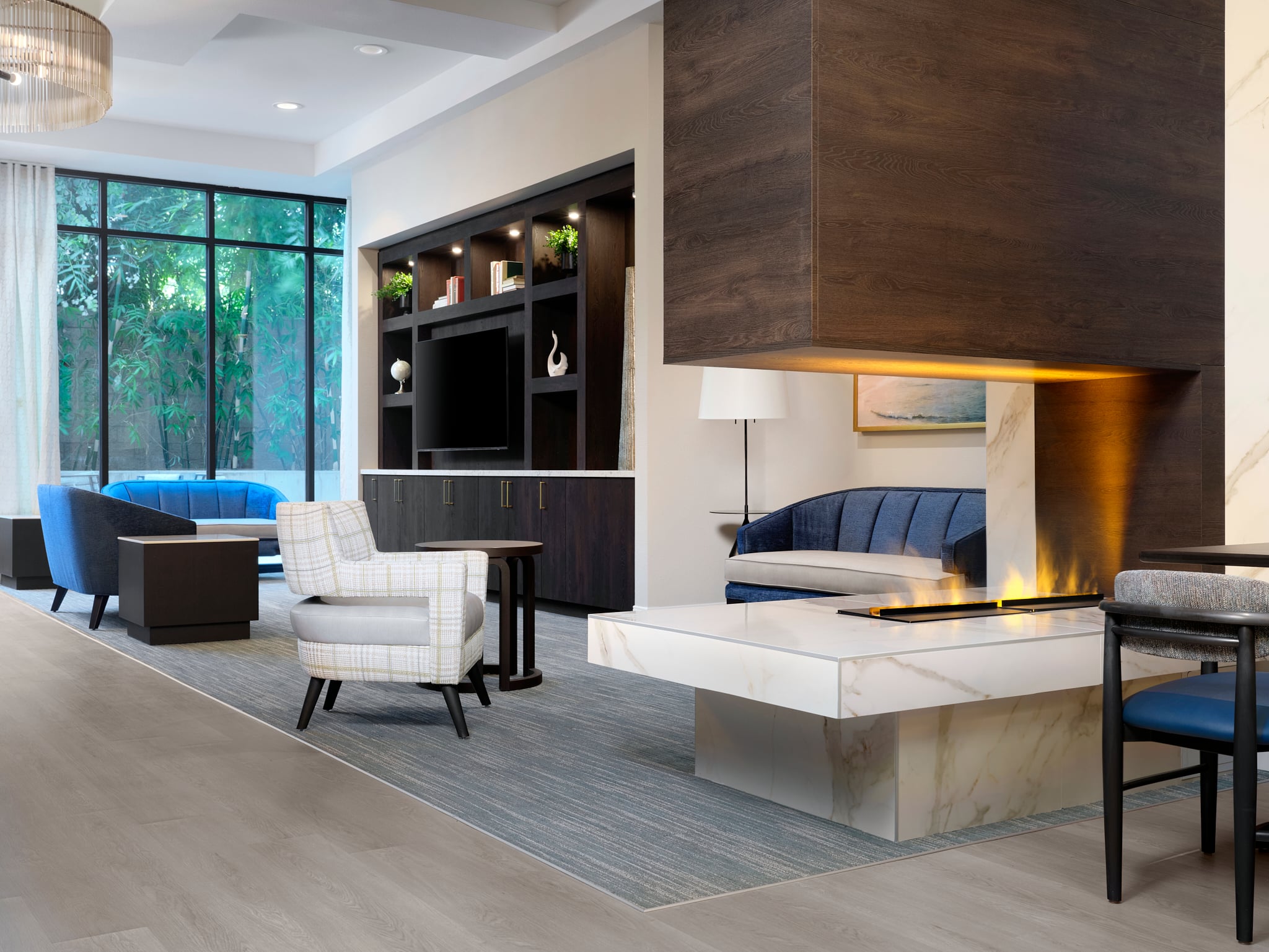 interior photo of the lobby at our memory care community, complete with a lounge area and fireplace