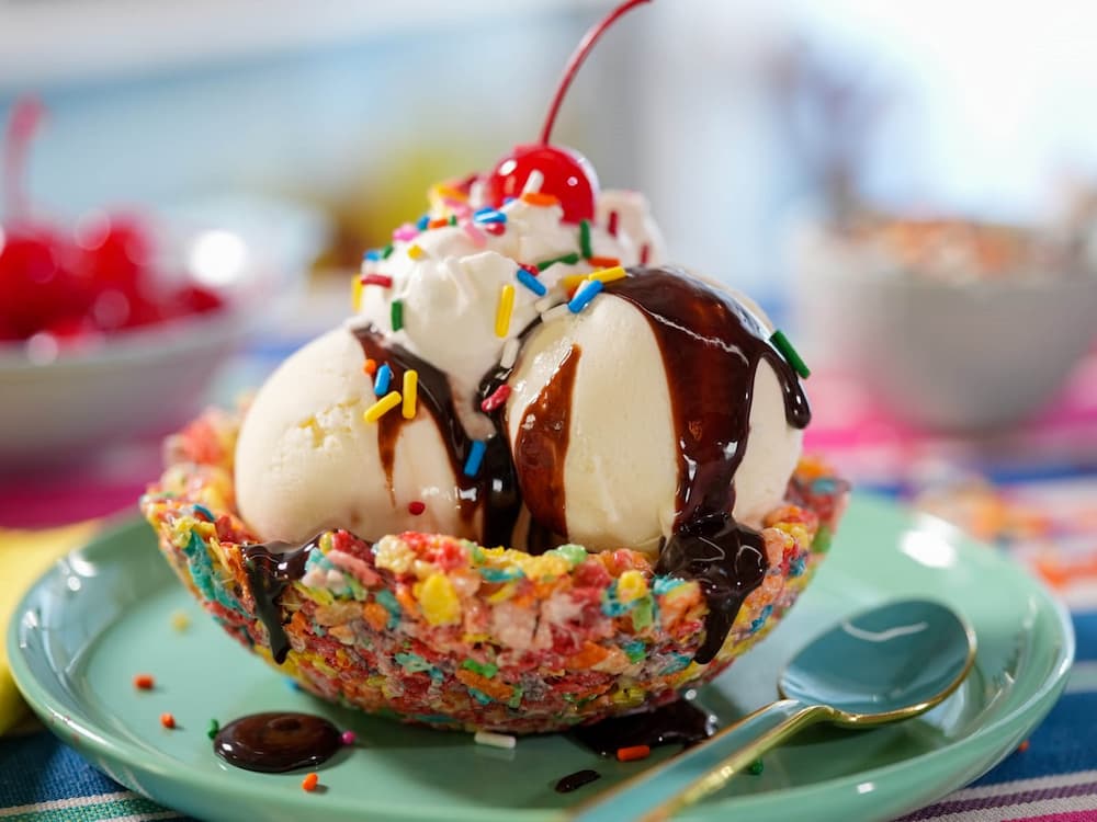 Photo of an ice cream sundae with a cherry on top.